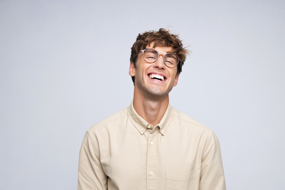 Man smiling with head tilted up